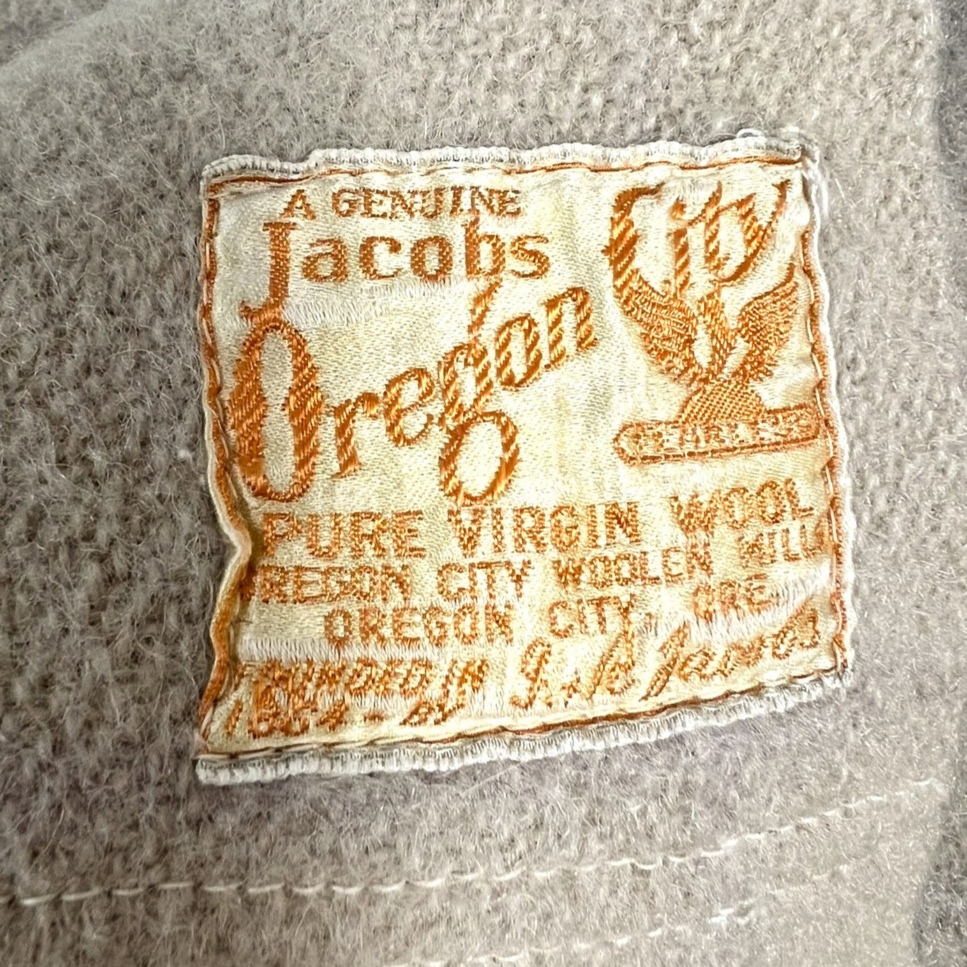 Jacobs Oregon label on a textured wool blanket background