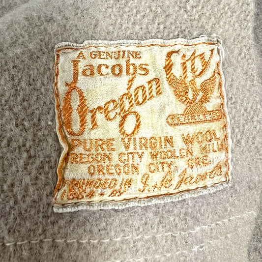 Jacobs Oregon label on a textured wool blanket background