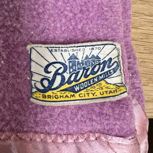 Baron Woolen Mills label on a purple wool blanket